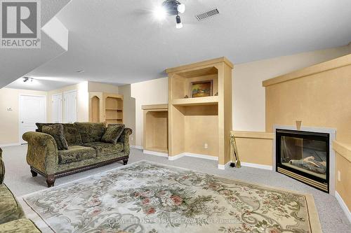 6983 Lakes Park Drive, Ottawa, ON - Indoor Photo Showing Living Room With Fireplace