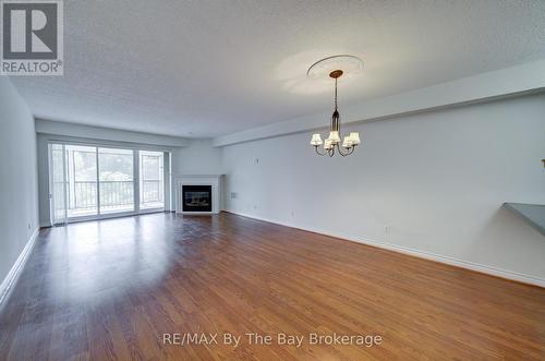 8 - 30 Mulligan Lane, Wasaga Beach, ON - Indoor Photo Showing Living Room With Fireplace