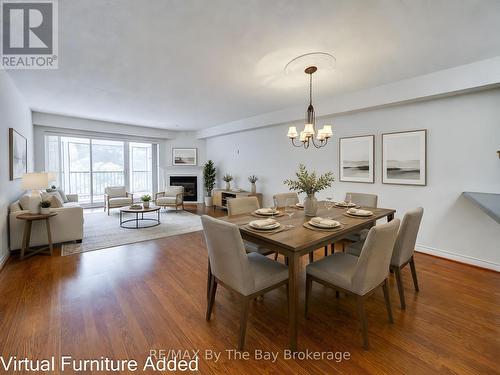 8 - 30 Mulligan Lane, Wasaga Beach, ON - Indoor Photo Showing Dining Room With Fireplace