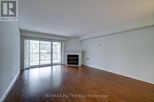 8 - 30 Mulligan Lane, Wasaga Beach, ON - Indoor Photo Showing Living Room With Fireplace