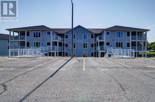 8 - 30 Mulligan Lane, Wasaga Beach, ON - Outdoor With Balcony With Facade