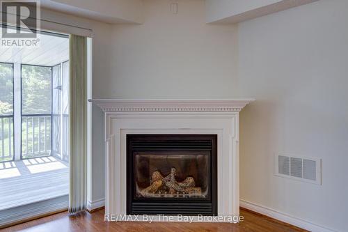 8 - 30 Mulligan Lane, Wasaga Beach, ON - Indoor Photo Showing Living Room With Fireplace