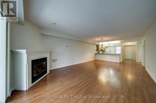 8 - 30 Mulligan Lane, Wasaga Beach, ON - Indoor Photo Showing Living Room With Fireplace
