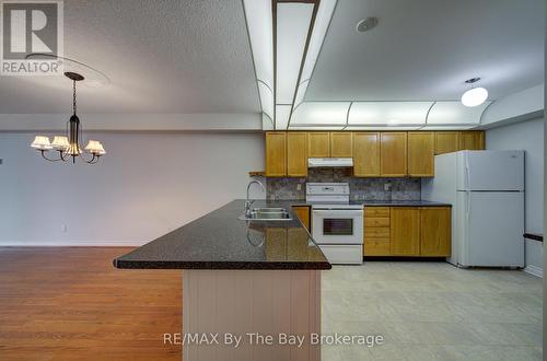 8 - 30 Mulligan Lane, Wasaga Beach, ON - Indoor Photo Showing Kitchen With Double Sink