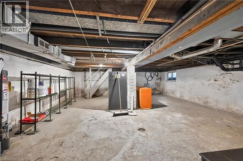 Unfinished basement featuring exposed joists and concrete flooring - 155 Newlands Avenue, Hamilton, ON - Indoor Photo Showing Basement