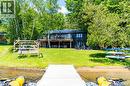 Beachfront and view of back of the property. - 1558 Fish Hatchery Road Unit# 10, Muskoka Lakes, ON  - Outdoor 