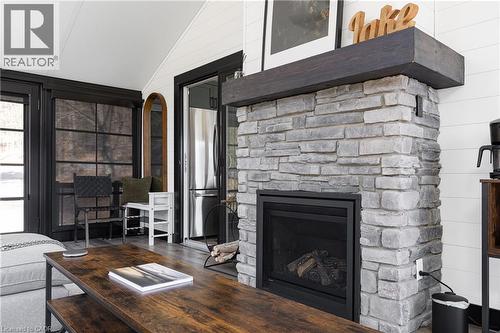 Muskoka Room fire pit - 1558 Fish Hatchery Road Unit# 10, Muskoka Lakes, ON - Indoor Photo Showing Living Room With Fireplace