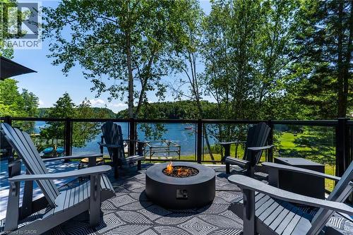 Upper Patio Deck Firepit area - 1558 Fish Hatchery Road Unit# 10, Muskoka Lakes, ON - Outdoor With Body Of Water