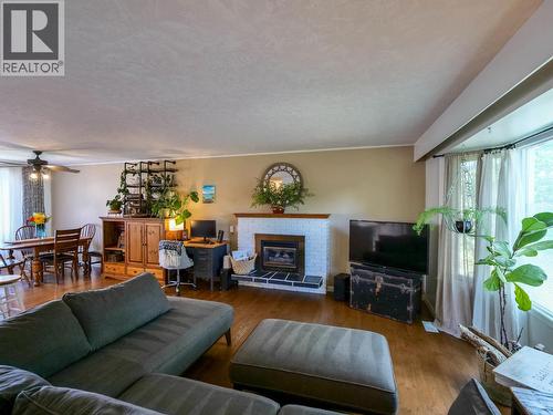 1291 Picard Avenue, Quesnel, BC - Indoor Photo Showing Living Room With Fireplace