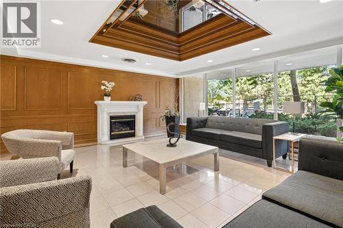 4 Willow Street Unit# 1101, Waterloo, ON - Indoor Photo Showing Living Room With Fireplace