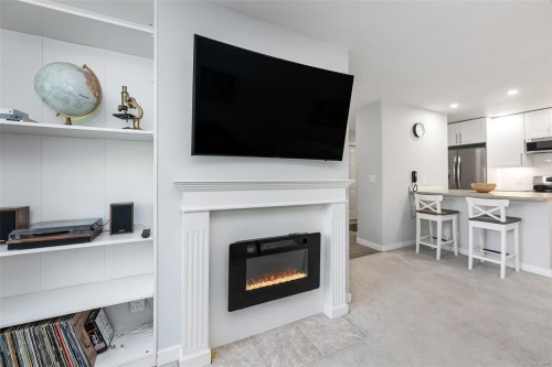 #201-3900 Shelbourne St, Saanich, BC - Indoor Photo Showing Living Room With Fireplace