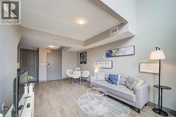 Open concept living area featuring wood-finish flooring - 