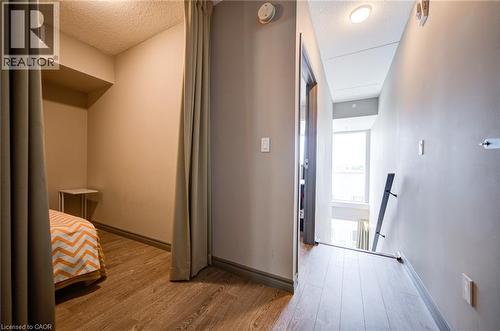 Hallway featuring wood-finish flooring, recessed lighting, and neutral wall tones - 321 Spruce Street Unit# 710, Waterloo, ON - Indoor Photo Showing Other Room