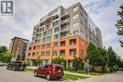 Modern multi-story building featuring a distinctive orange and gray facade - 