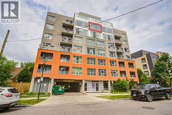 Modern multi-story building featuring a distinctive orange and gray facade - 