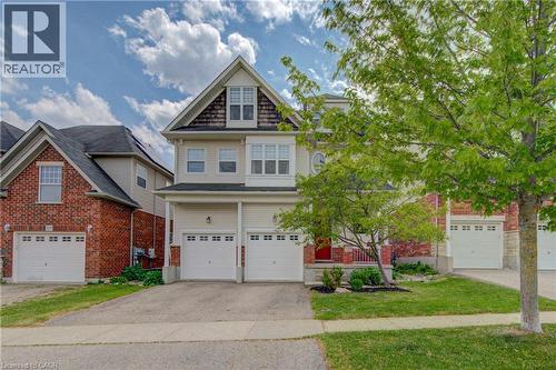 Two-story residence featuring light-toned siding and brick accents - 729 Keats Way, Waterloo, ON - Outdoor With Facade