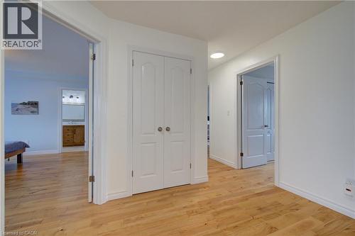 Hardwood-finish flooring throughout, white walls, and bright white trim - 729 Keats Way, Waterloo, ON - Indoor