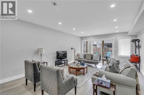 Spacious living area featuring light wood-finish flooring, recessed lighting, and light-toned walls - 2195 Ironwood Road, London, ON - Indoor Photo Showing Living Room