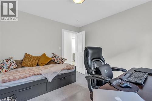 Carpeted room with a recessed ceiling light, light gray walls, and white trim - 2195 Ironwood Road, London, ON - Indoor