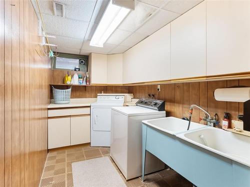 nice laundry room with extra storage - 129 St Michael Road, Winnipeg, MB - Indoor Photo Showing Laundry Room