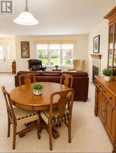 6 Edgewater Drive, Brighton, ON - Indoor Photo Showing Dining Room With Fireplace