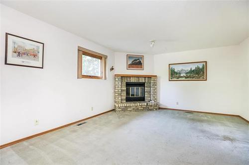 43 Calder Bay, Winnipeg, MB - Indoor Photo Showing Living Room With Fireplace