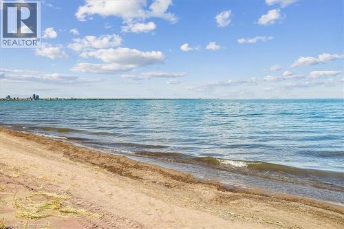 Sandy shoreline with gentle waves - 573 Beach Boulevard, Hamilton, ON - Outdoor With Body Of Water With View