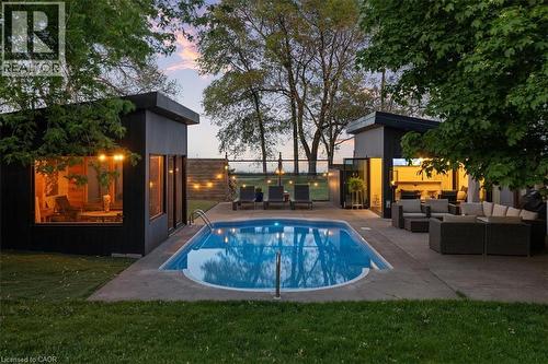 Backyard oasis featuring an in-ground swimming pool with concrete surround - 573 Beach Boulevard, Hamilton, ON - Outdoor With In Ground Pool With Deck Patio Veranda With Backyard