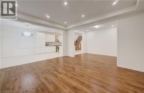 Expansive interior space featuring wood-finish flooring, recessed lighting, and crown molding - 52 Pointer Street, Cambridge, ON - Indoor