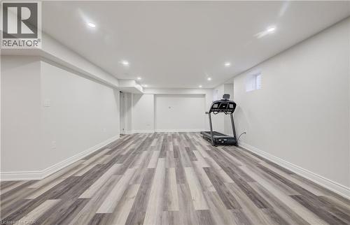 Finished lower level featuring wood-finish flooring, recessed lighting, and bright white walls - 52 Pointer Street, Cambridge, ON - Indoor