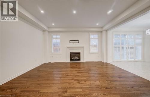 Spacious interior featuring wood-finish flooring and recessed lighting - 52 Pointer Street, Cambridge, ON - Indoor With Fireplace