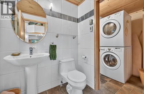 MAIN FLOOR POWDER ROOM AND LAUNDRY ROOM - 4404 Coy Road, Invermere, BC - Indoor Photo Showing Laundry Room