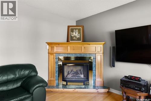 433 9Th Avenue W, Melville, SK - Indoor Photo Showing Living Room With Fireplace