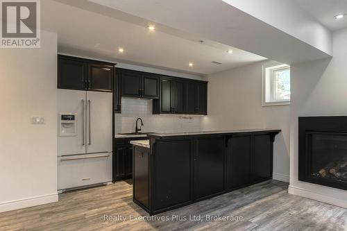 Kitchen/Wet Bar in Basement - 27 Kingfisher Crescent, Tiny, ON - Indoor Photo Showing Kitchen