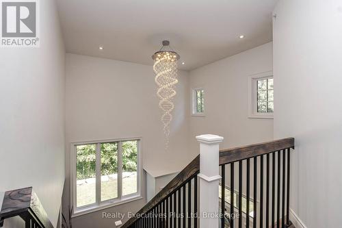 Upper Foyer Chandalier - 27 Kingfisher Crescent, Tiny, ON - Indoor Photo Showing Other Room