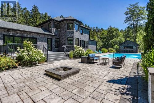 Pool Patio Area with Fireplace - 27 Kingfisher Crescent, Tiny, ON - Outdoor With In Ground Pool With Deck Patio Veranda