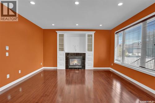 6033 Little Pine Loop, Regina, SK - Indoor Photo Showing Other Room With Fireplace