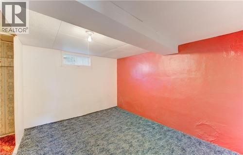 Carpeted room featuring a white wall with a horizontal window - 224 Weber Street E, Kitchener, ON - Indoor