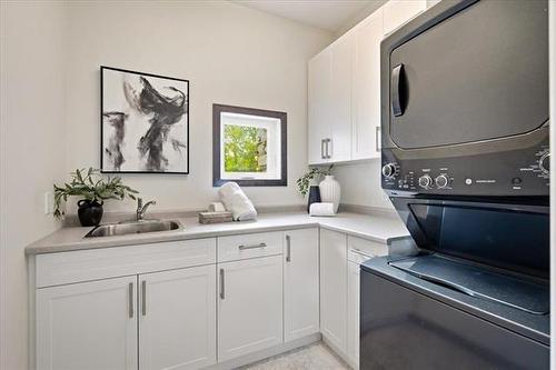6975 Roblin Blvd, Headingley, MB - Indoor Photo Showing Laundry Room