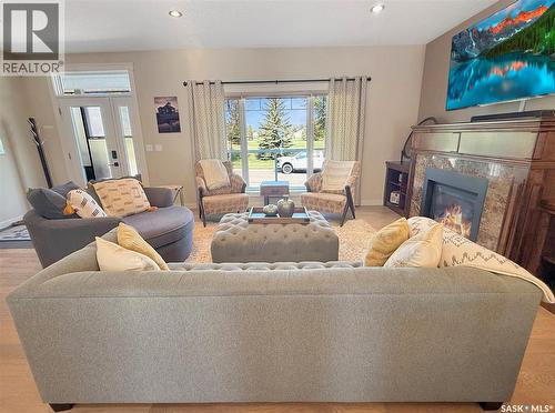 702 Cooper Drive, Swift Current, SK - Indoor Photo Showing Living Room With Fireplace