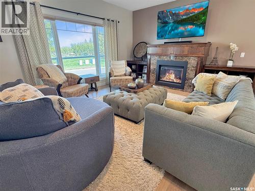 702 Cooper Drive, Swift Current, SK - Indoor Photo Showing Living Room With Fireplace