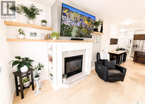 34 533 4Th Avenue Ne, Swift Current, SK - Indoor Photo Showing Living Room With Fireplace