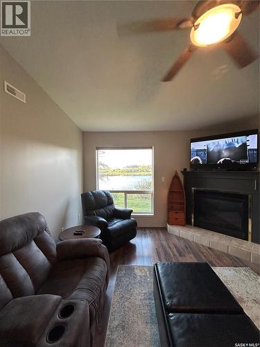 3830 First Point Beach Drive, Wakaw Lake, SK - Indoor Photo Showing Living Room With Fireplace