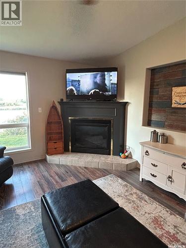3830 First Point Beach Drive, Wakaw Lake, SK - Indoor Photo Showing Living Room With Fireplace