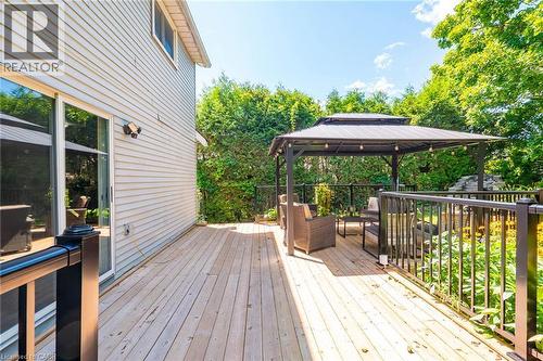 Expansive outdoor deck featuring wood flooring and black metal railings - 34 Peachtree Crescent, Cambridge, ON - Outdoor With Deck Patio Veranda