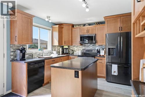 523 Denham Way, Saskatoon, SK - Indoor Photo Showing Kitchen With Double Sink