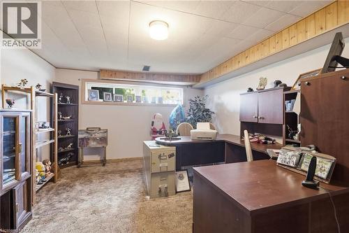 Finished room featuring a drop ceiling, a horizontal window, and wood paneling accents - 46 Brett Court, Hamilton, ON - Indoor Photo Showing Office