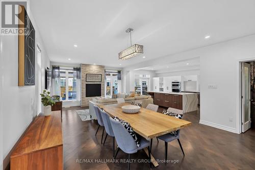 878 Excursion Way, Ottawa, ON - Indoor Photo Showing Dining Room With Fireplace
