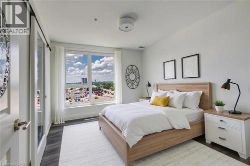 Expansive window featuring distant city and urban scenery - 1333 Weber Street E Unit# 708, Kitchener, ON - Indoor Photo Showing Bedroom