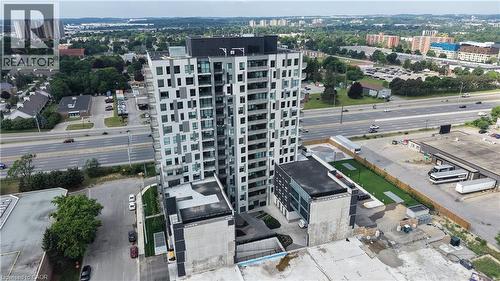 Contemporary high-rise building featuring a grey and white facade with extensive window detailing and individual balconies - 1333 Weber Street E Unit# 708, Kitchener, ON - Outdoor With View